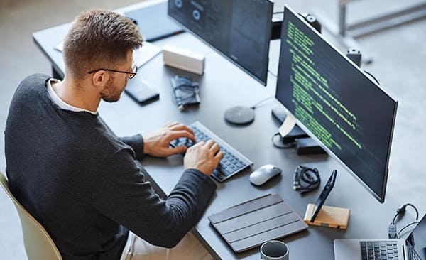 Coder at his desk